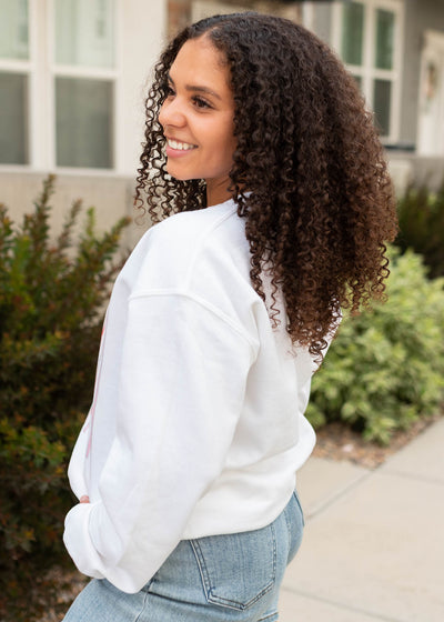 Side view of the ciao bella white sweatshirt