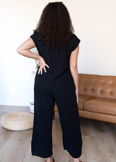 Back view of the black button up jumpsuit
