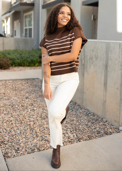 Hazelnut sweater without sleeves and has cream stripes