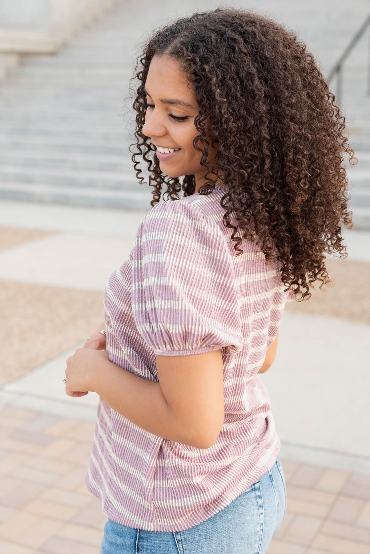 Side view of the pink stripe ribbed top