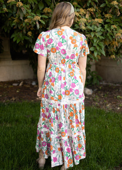 Back view of a tan floral dress