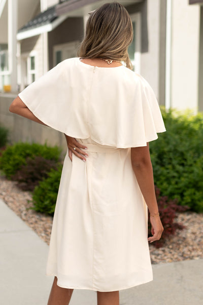 Back view of a cream dress
