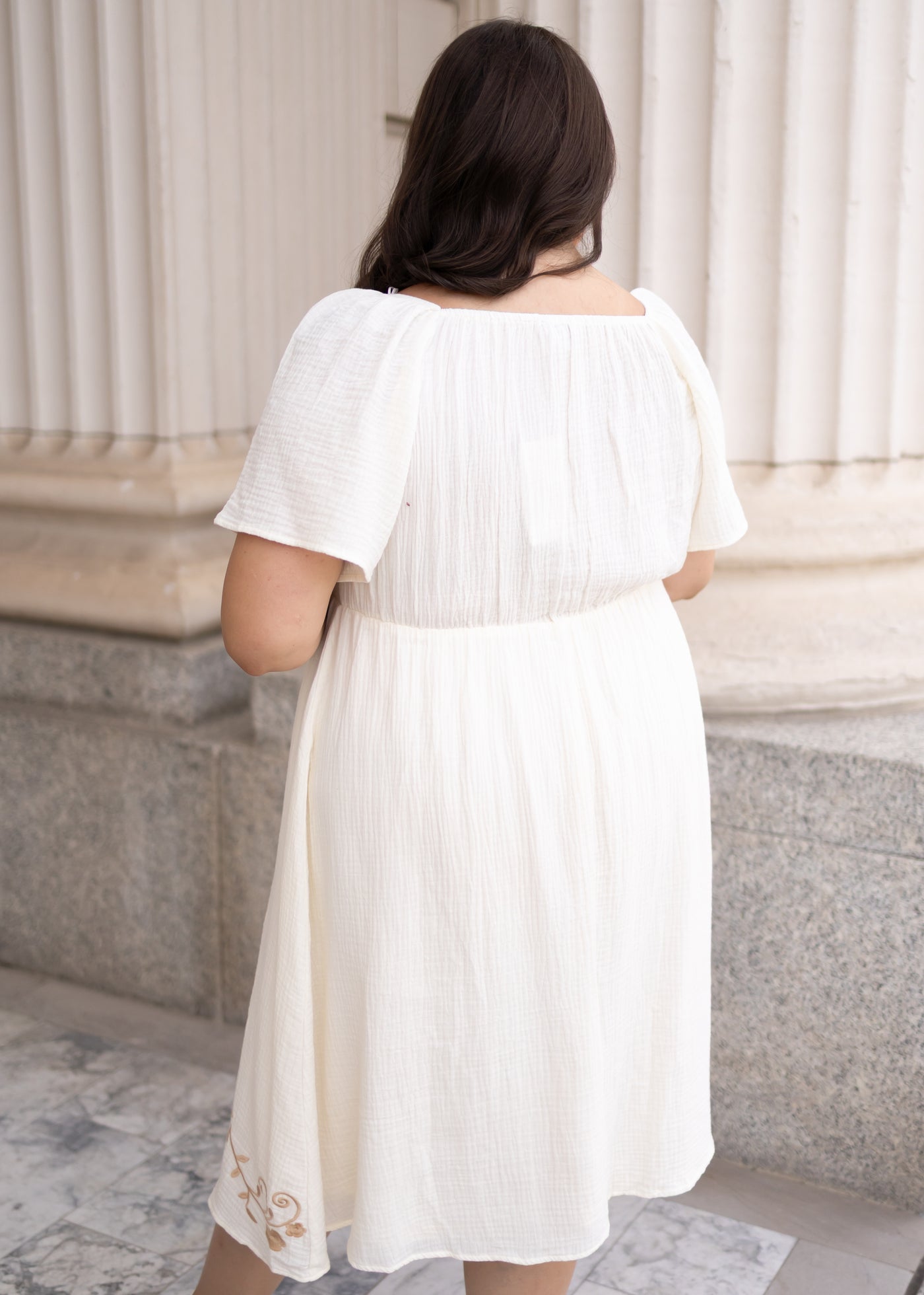 Backview of the ivory embroidered dress in plus size