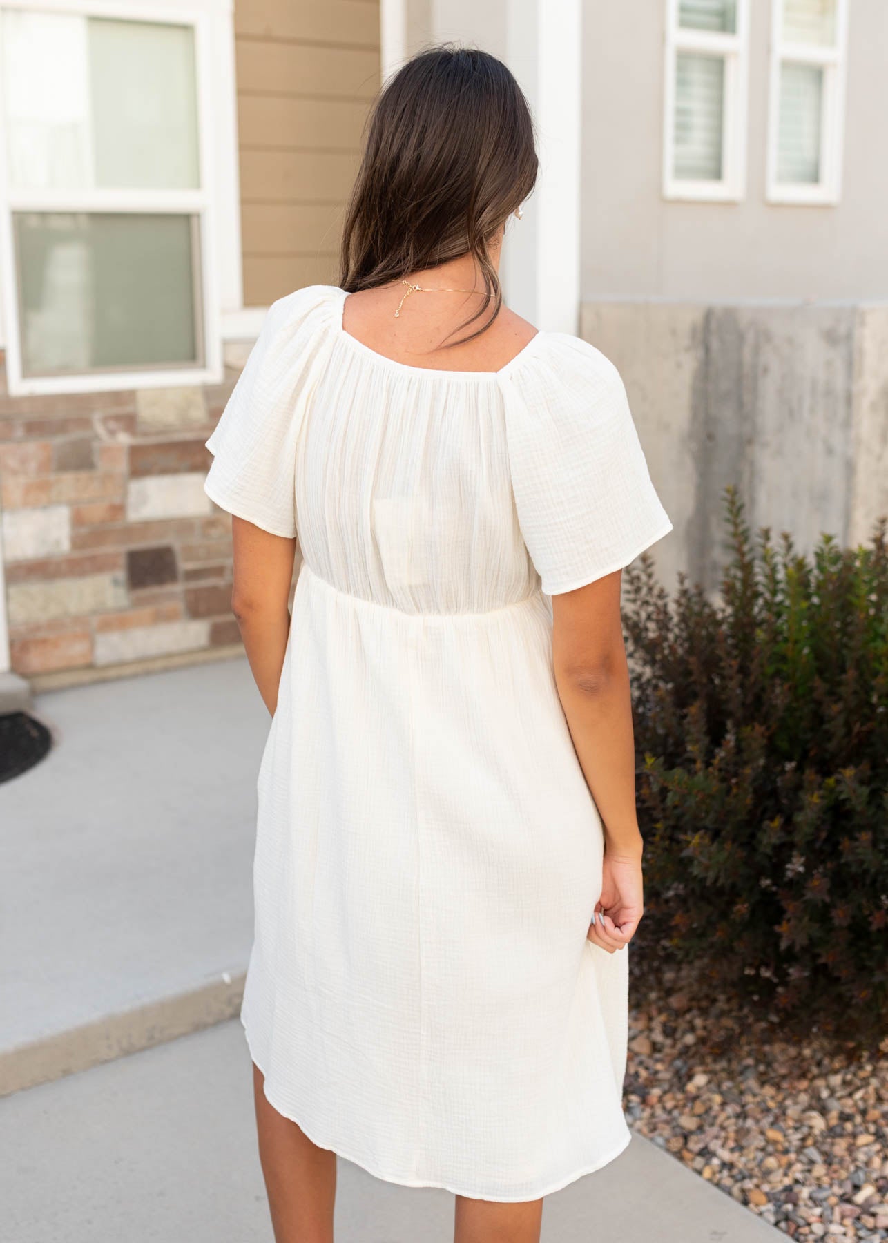 Back view of the ivory embroidered dress at Lena Layne