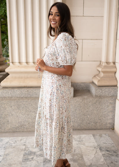 Modest side view of the cream floral dress.