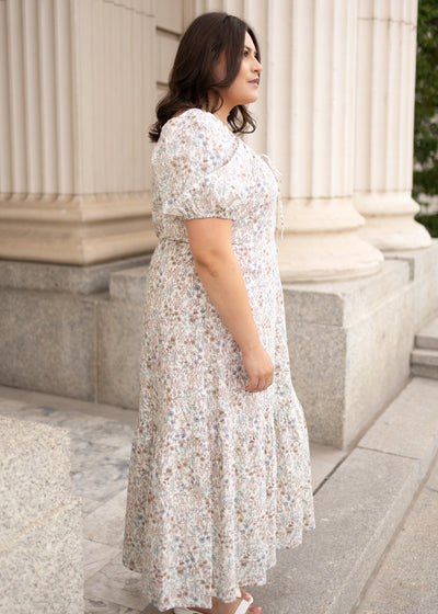 Side view of the plus size Lena Lou cream floral dress
