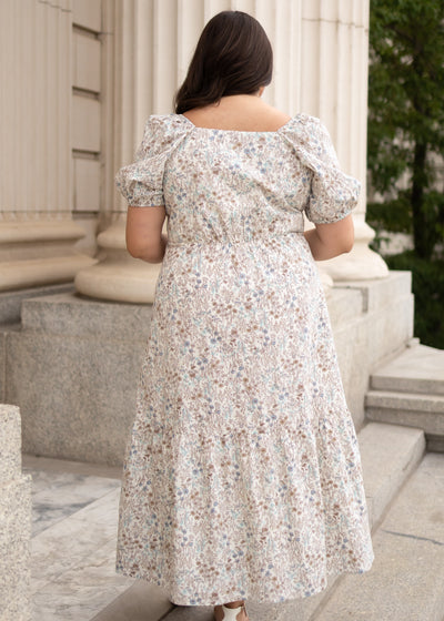 Back view of the plus size cream floral dress