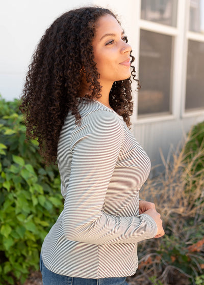 Side view of the black striped top