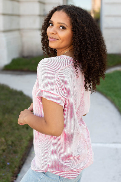 Side view of the pink ribbed top