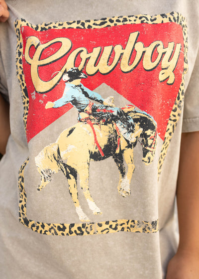 Close up of the graphic with a horse on the light mocha graphic tee