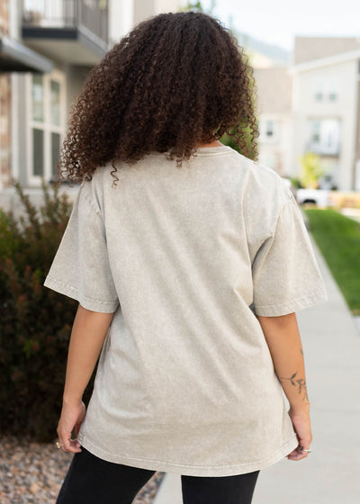 Back view of the cowboy light mocha graphic tee