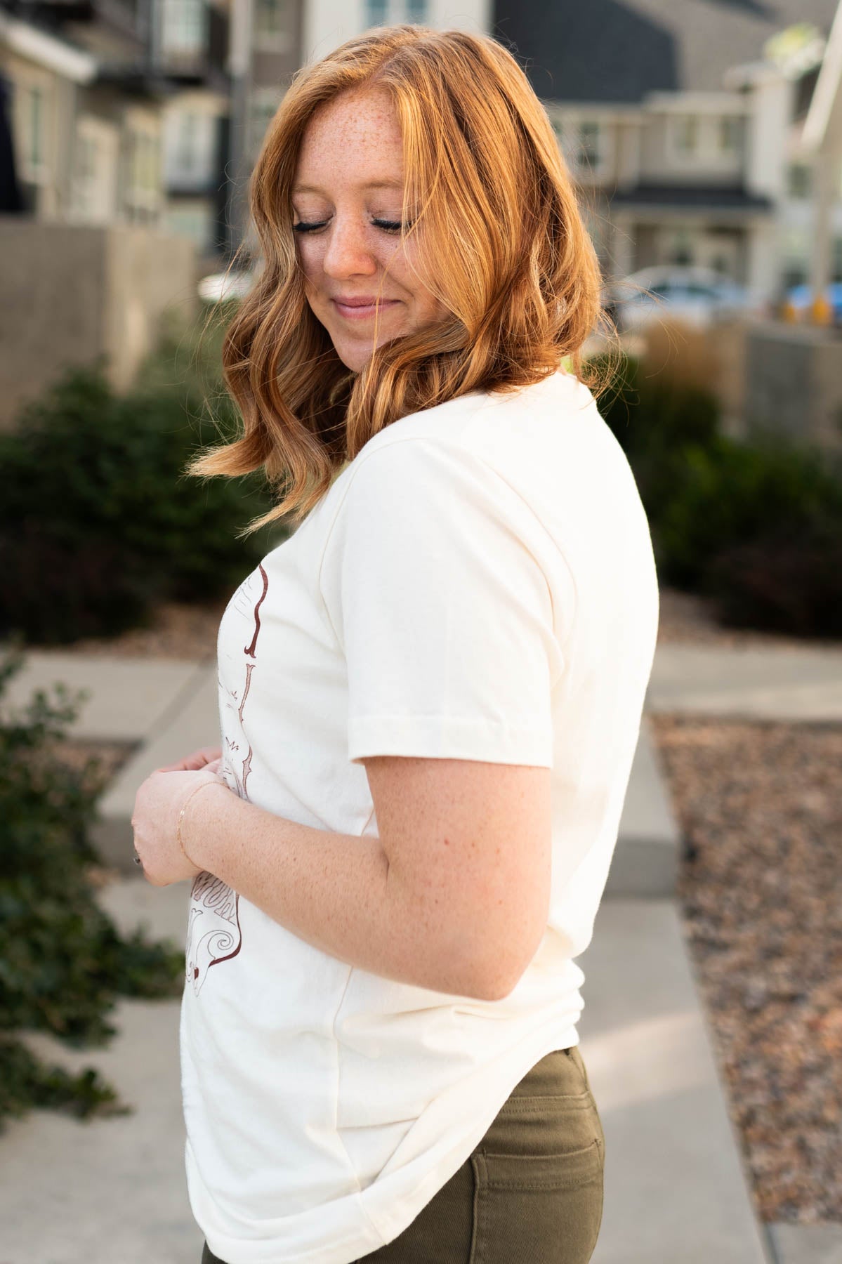 Side view of a cowgirl cream top