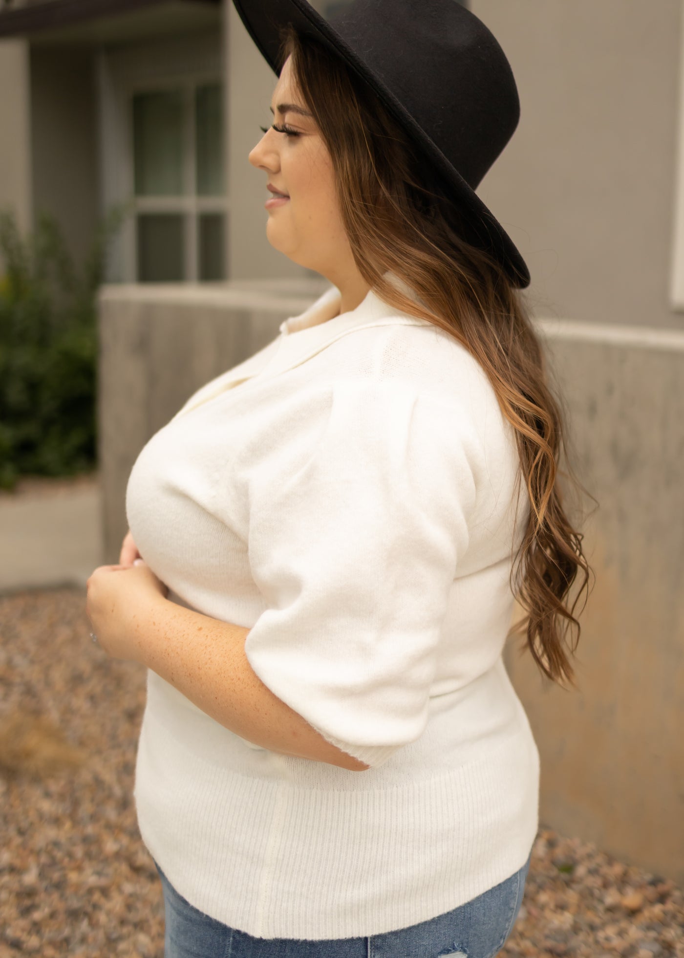 Side view of a short sleeve ivory top