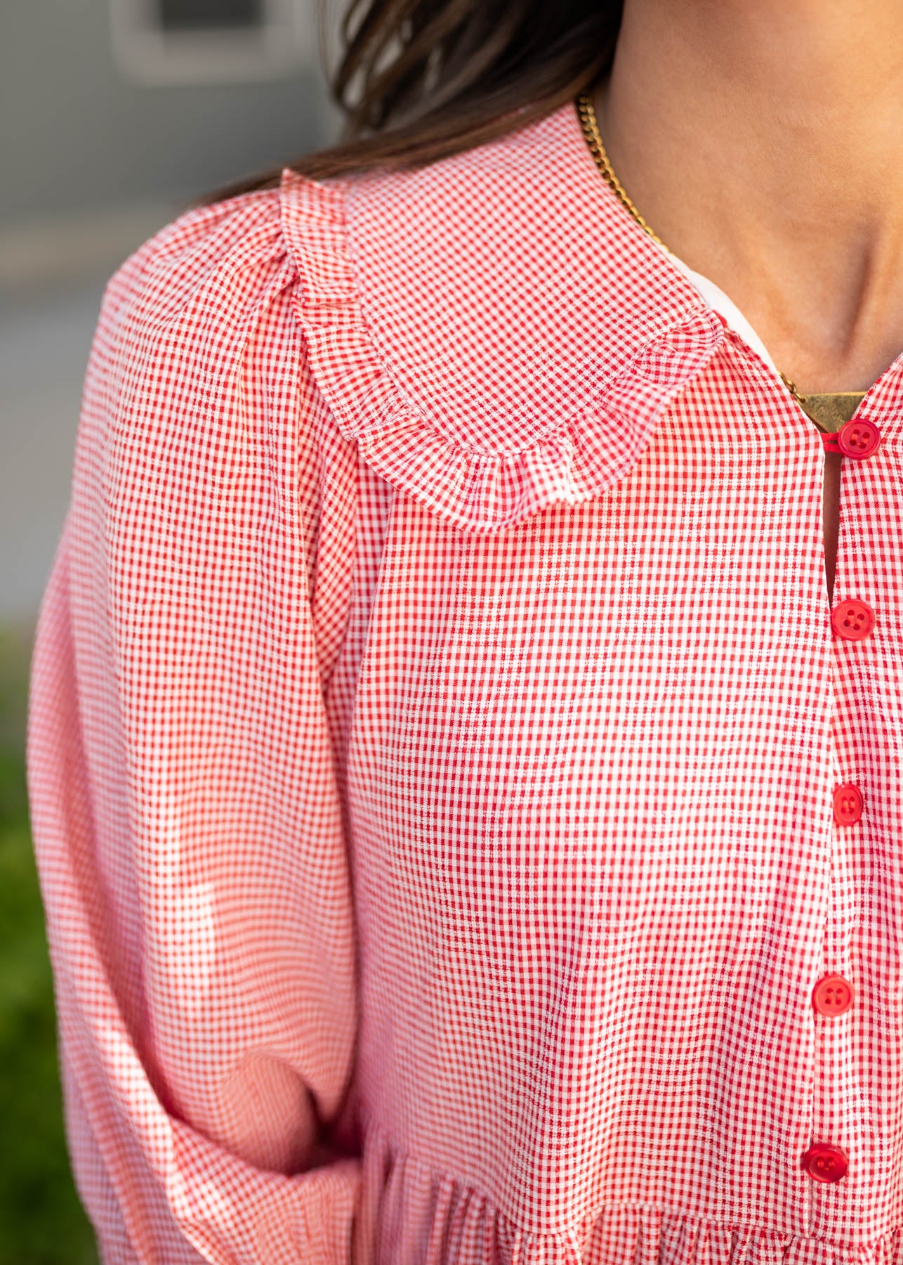 Close up of the fabric and collar on the red gingham dress