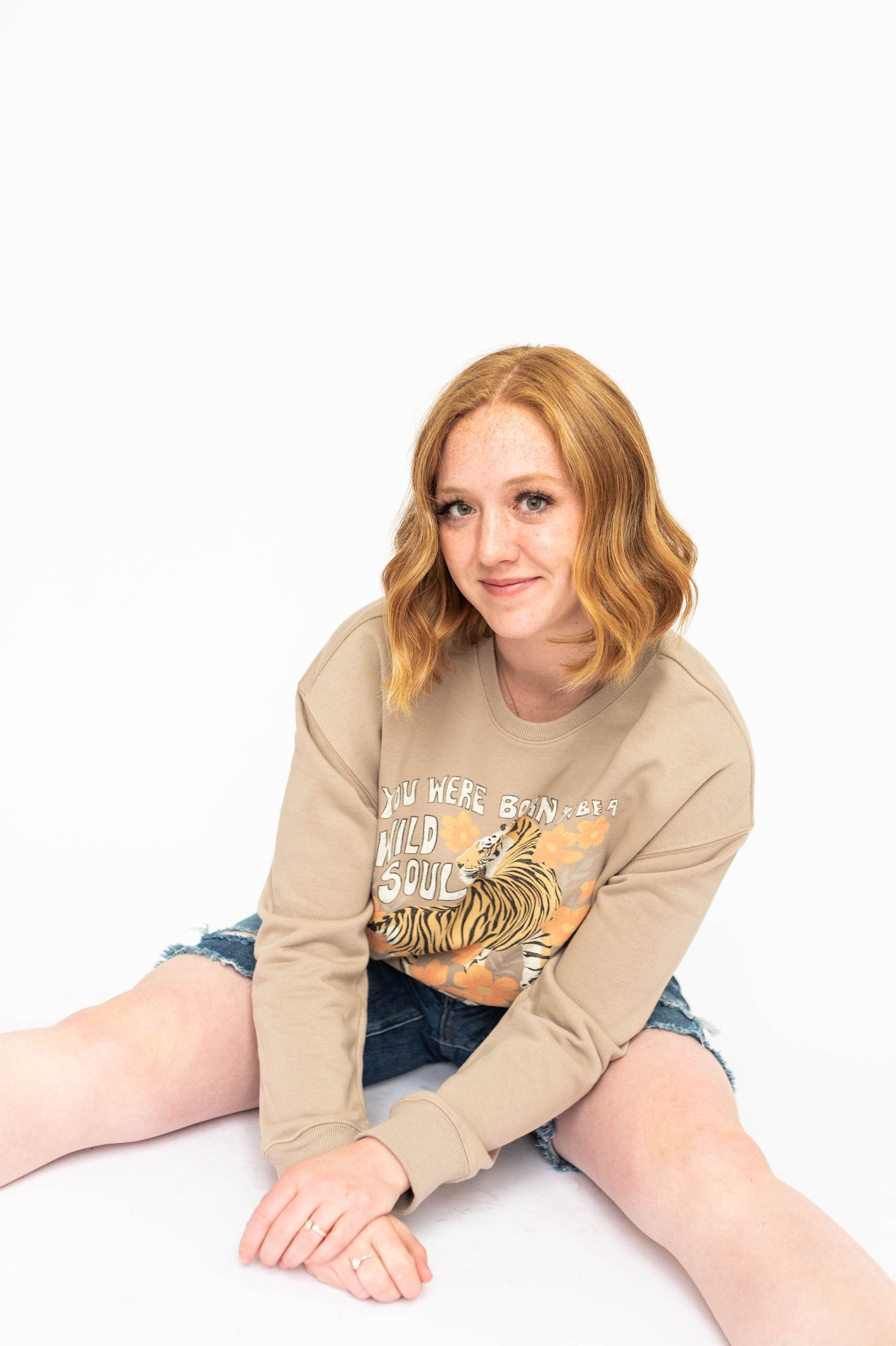 Tan tiger shirt.