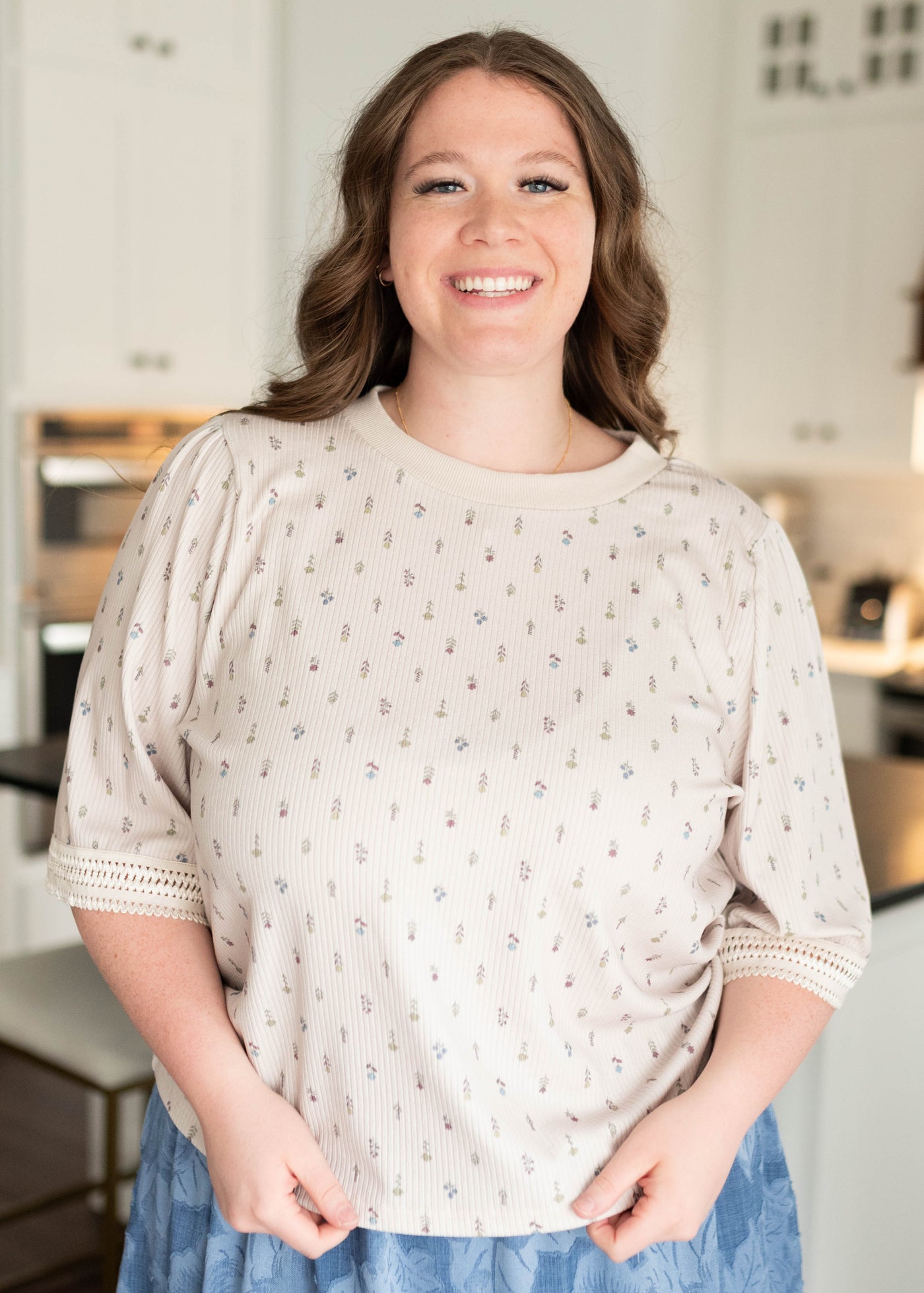 Short sleeve cream floral top with lace trim on the cuffs in plus size
