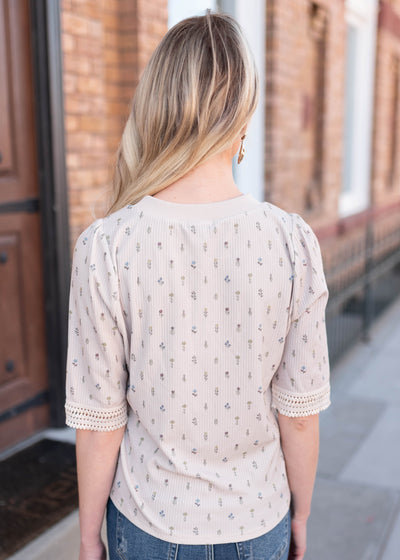 Back view of the cream floral top by Lena & Lou