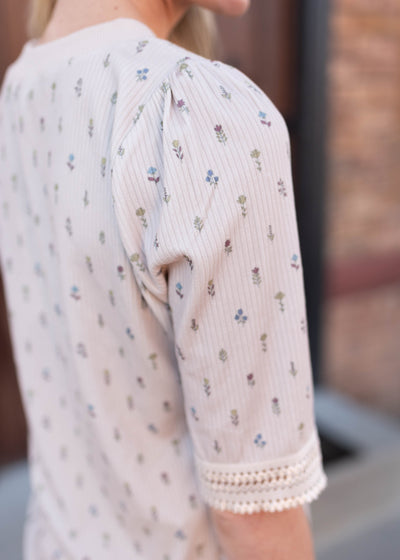 Back view of the cream floral top