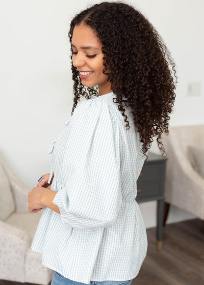 Side view of the light blue stripe top