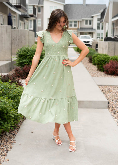 Smocked olive floral embroidered dress with a v-neck