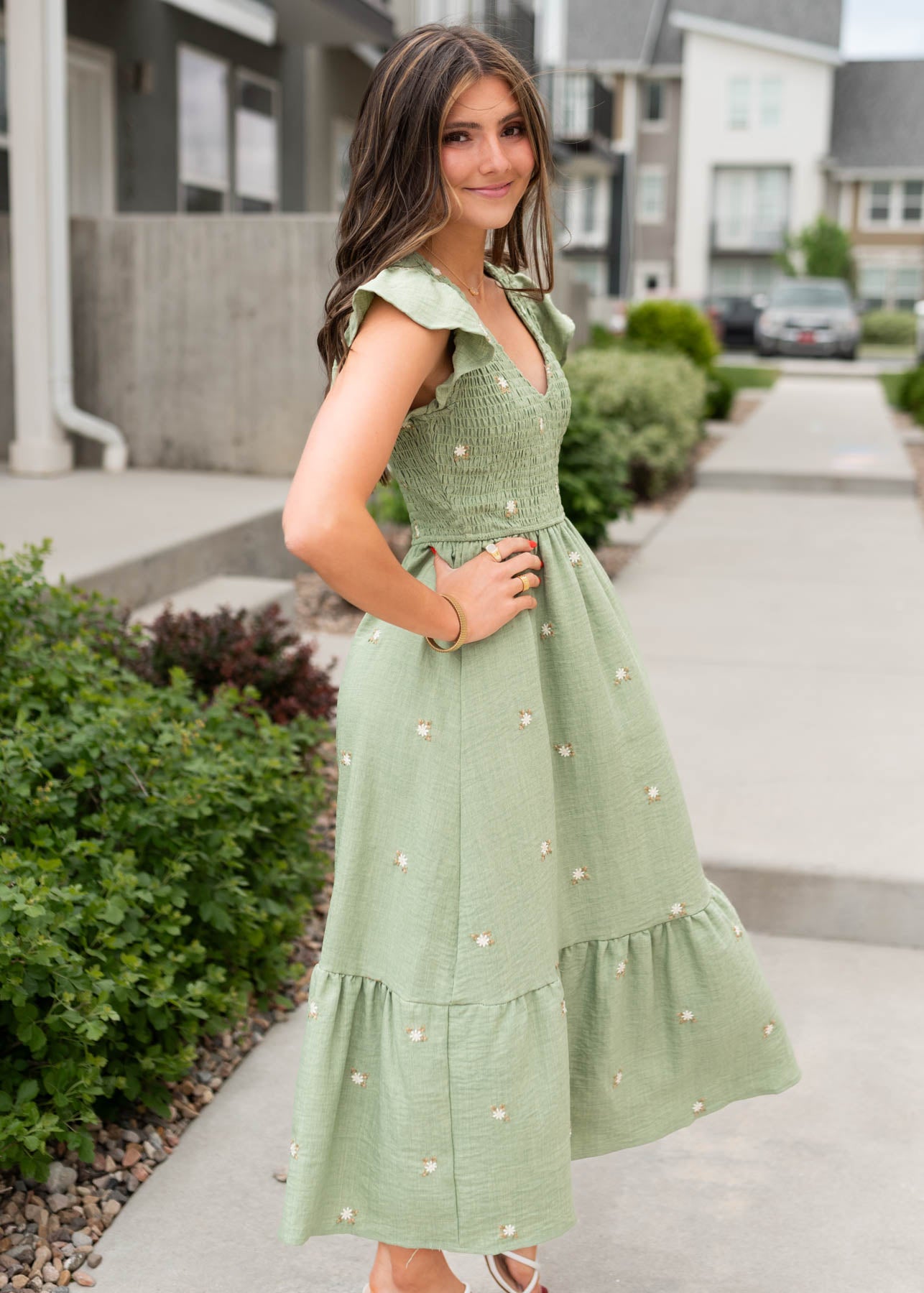 Side view of the olive floral embroidered dress