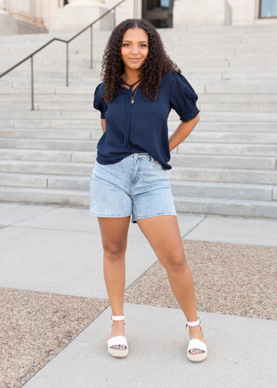 Tie at the neck on the navy top