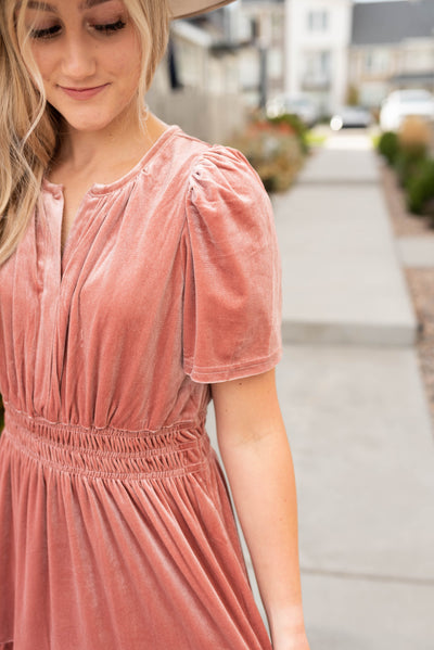 Close up view of the velvet blush dress