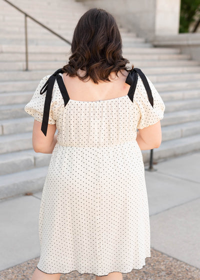 Back view of the plus size ivory polka dot dress
