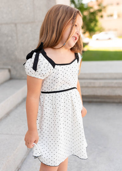 Side view of the ivory polka dot little girl dress