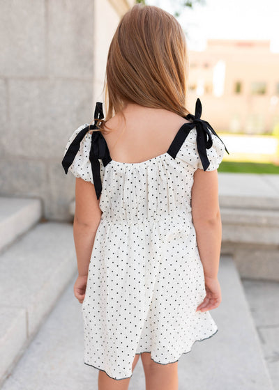Back view of the ivory polka dot little girl dress