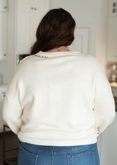Back view of the cream embridered cardigan