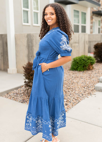 Side view of the blue embroidered dress