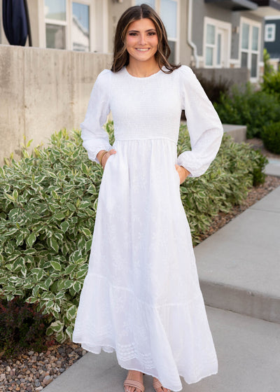 Long sleeve white smocked dress with pockets