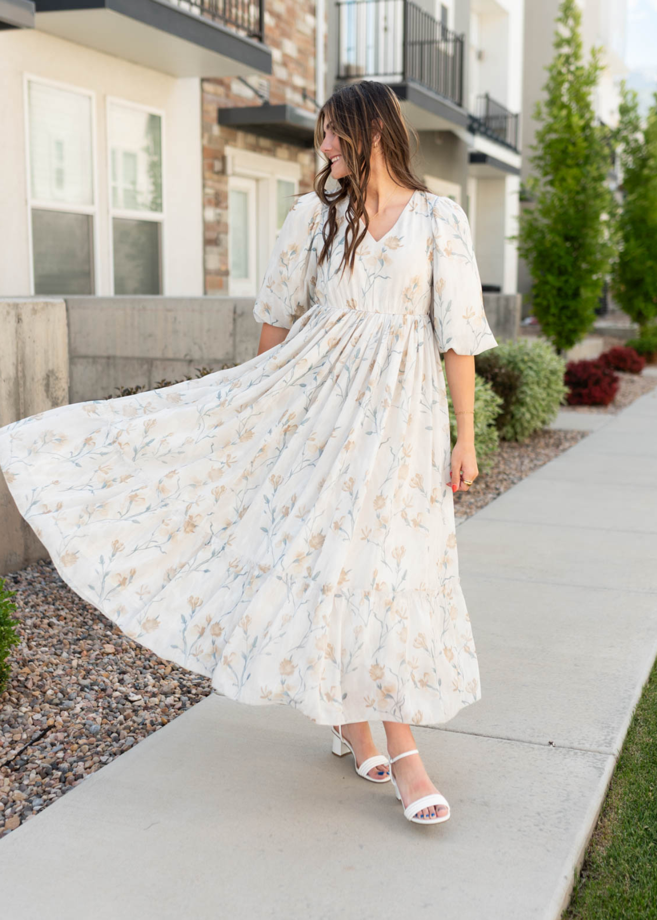 Cream flower dress with a wide ruffle hem
