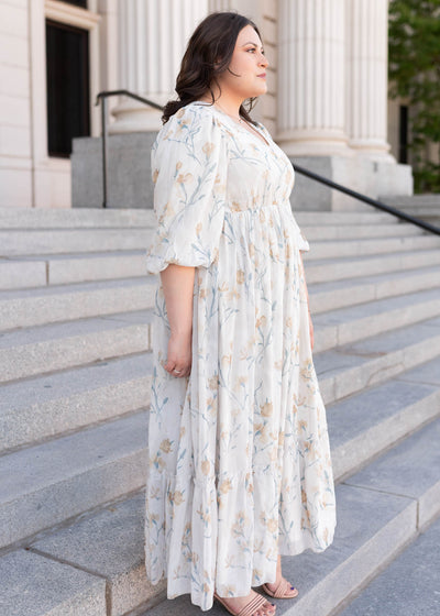 Side view of the plus size cream flower dress
