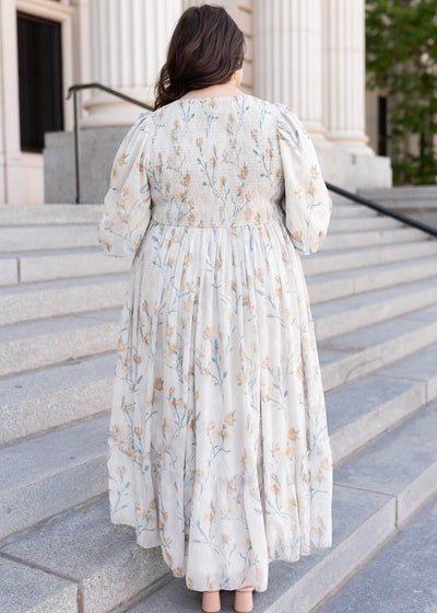 Back view of the cream flower dress in plus size