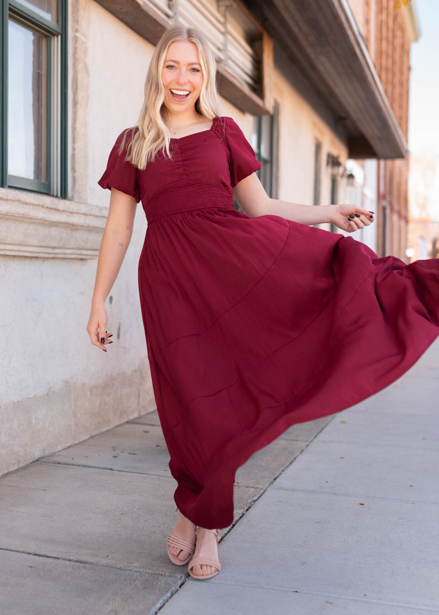 Smocked  waist band on the burgundy smocked dress maxi length