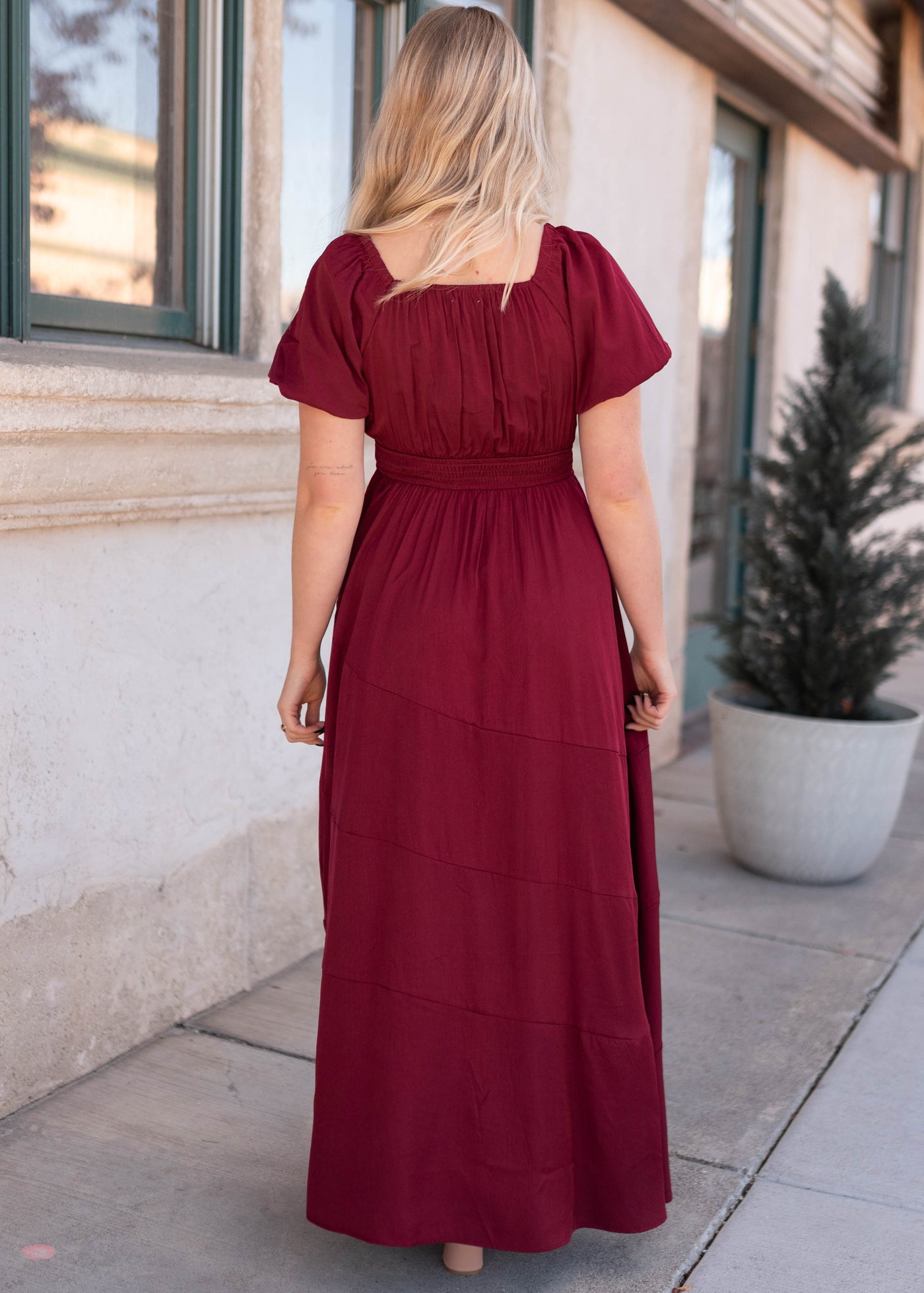 Back view of the burgundy smocked dress