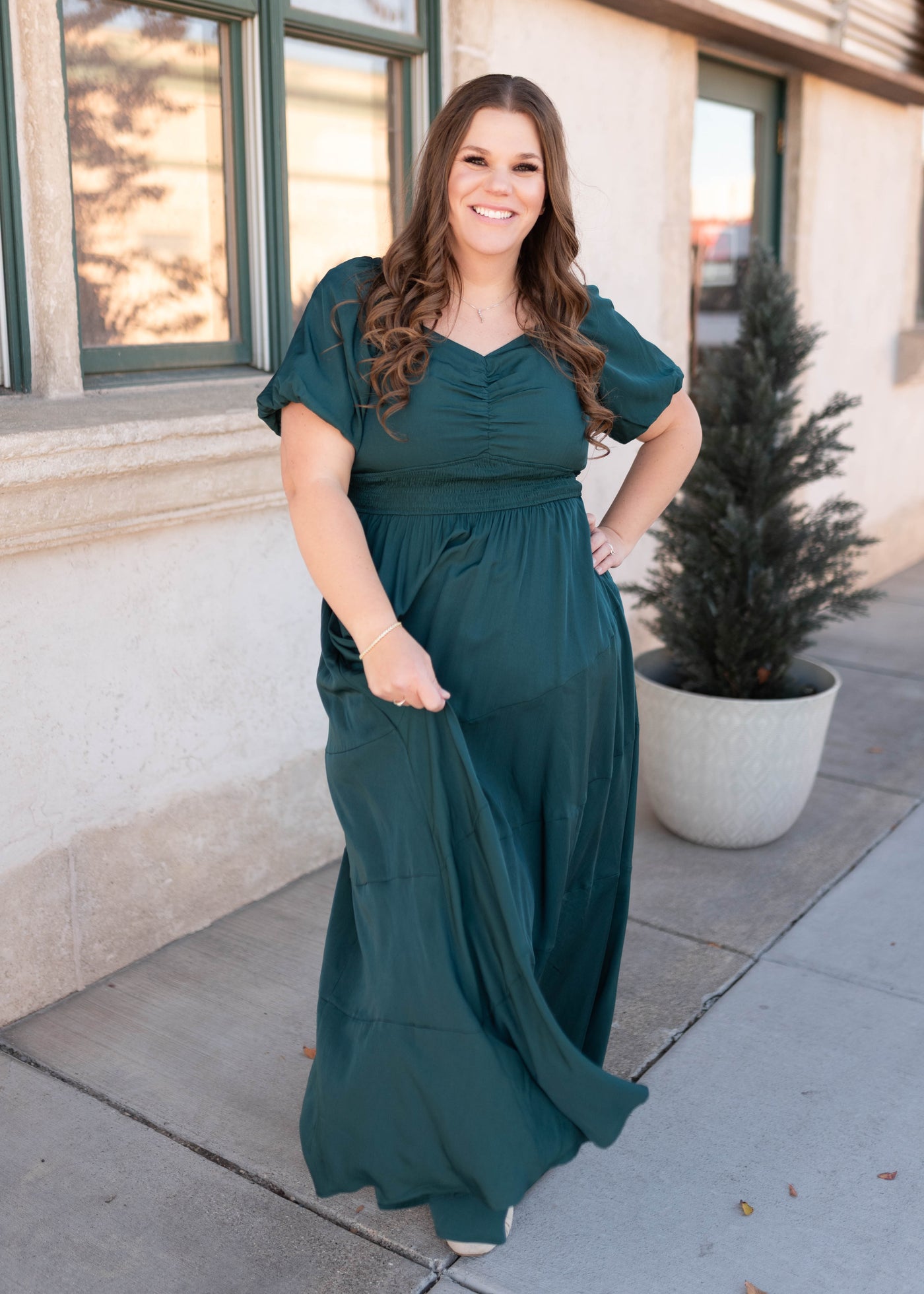 Maxi length green smocked dress with smocking around the waist in plus size