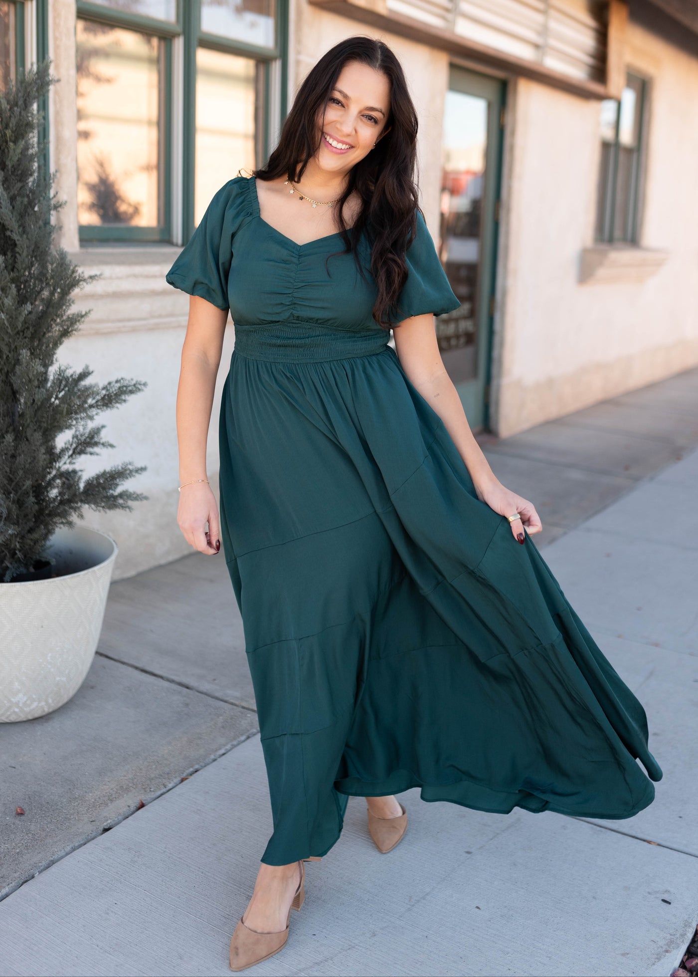 Short sleeve modest green smocked dress with smocking around the waist