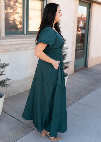 Side view of the modest green smocked dress in plus size