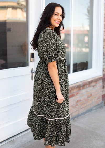 Side view of the dark olive floral dress