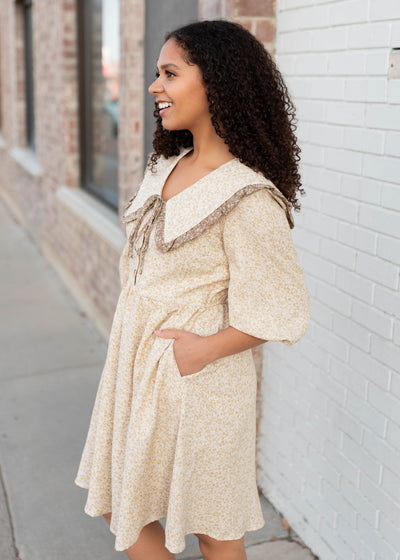 Side view of the taupe floral dress