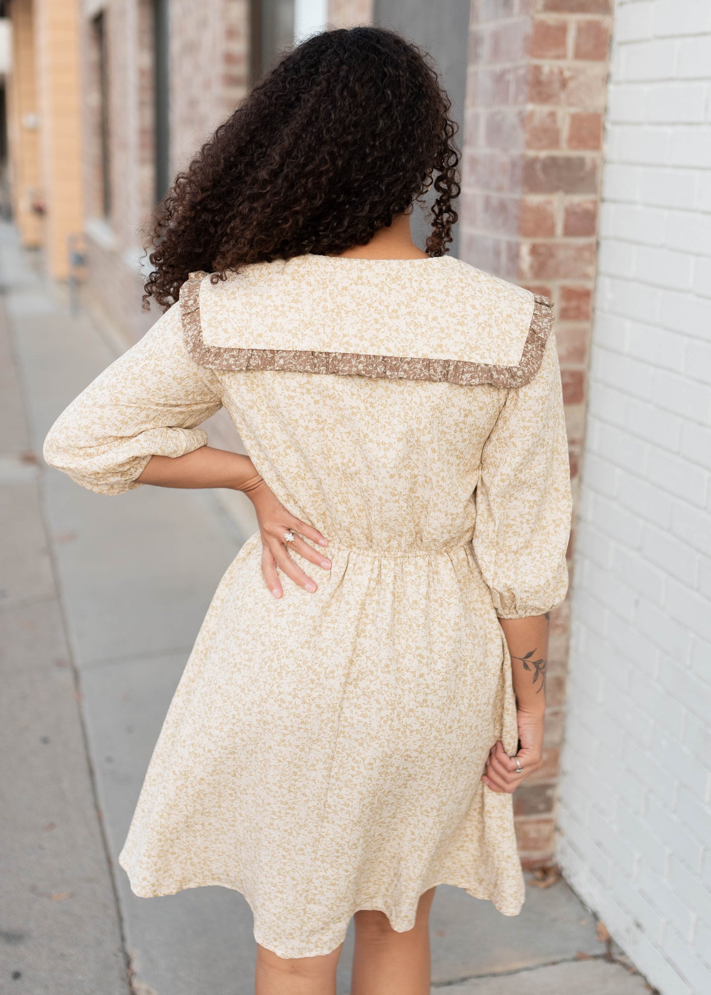 Back view of the taupe floral dress