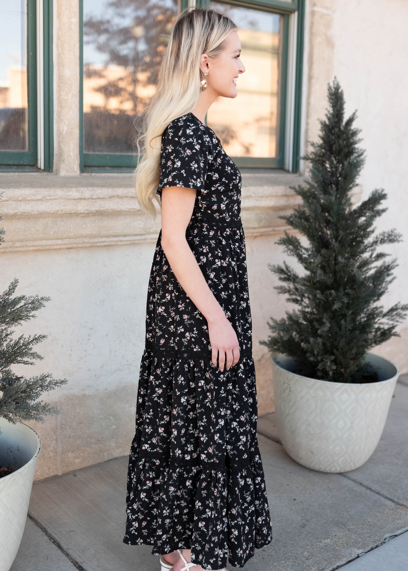 Side view of the short sleeve black floral dress by Lena & Layne