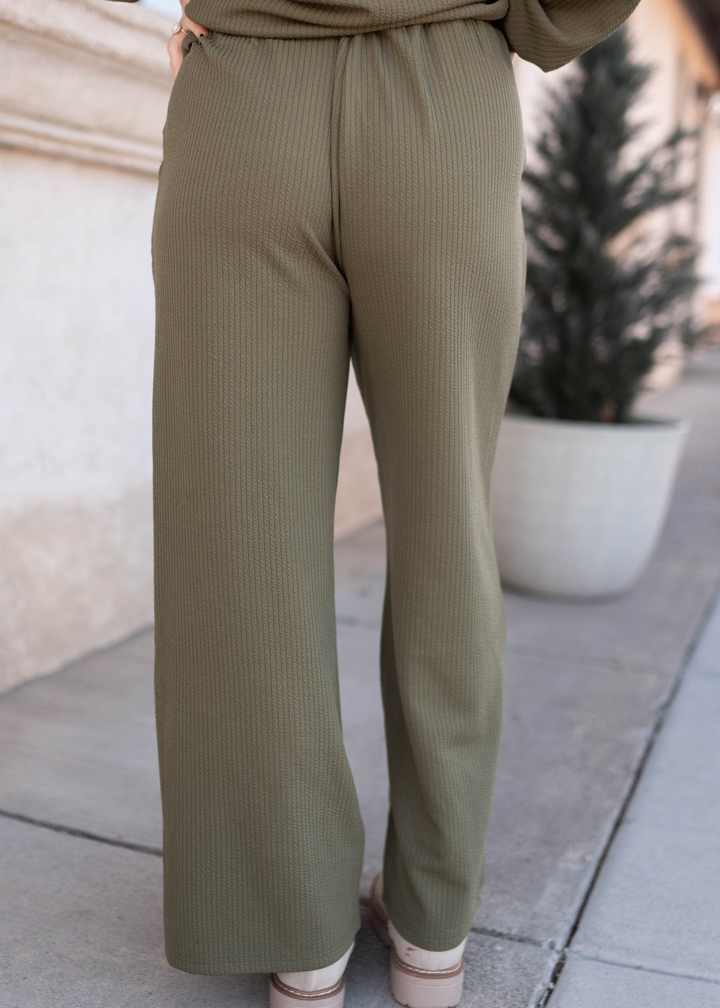 Back view of the olive textured pants