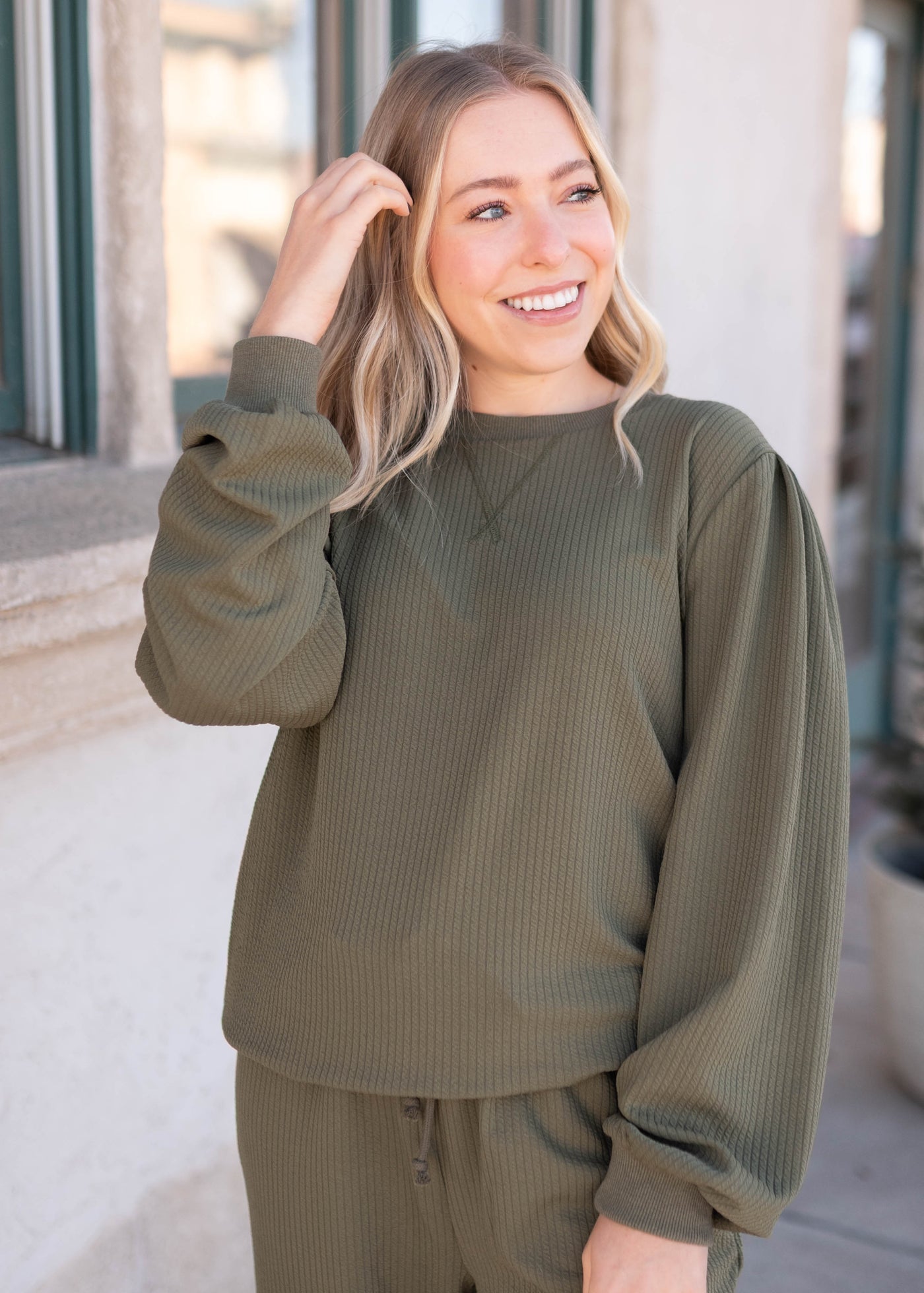 Olive textured pulloer with gathers on the shoulder