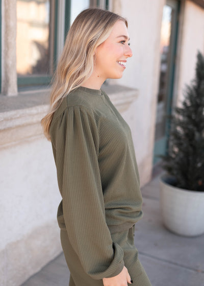 Side view of the olive textured pullover