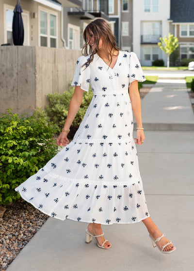 White embroidered dress with lace trim