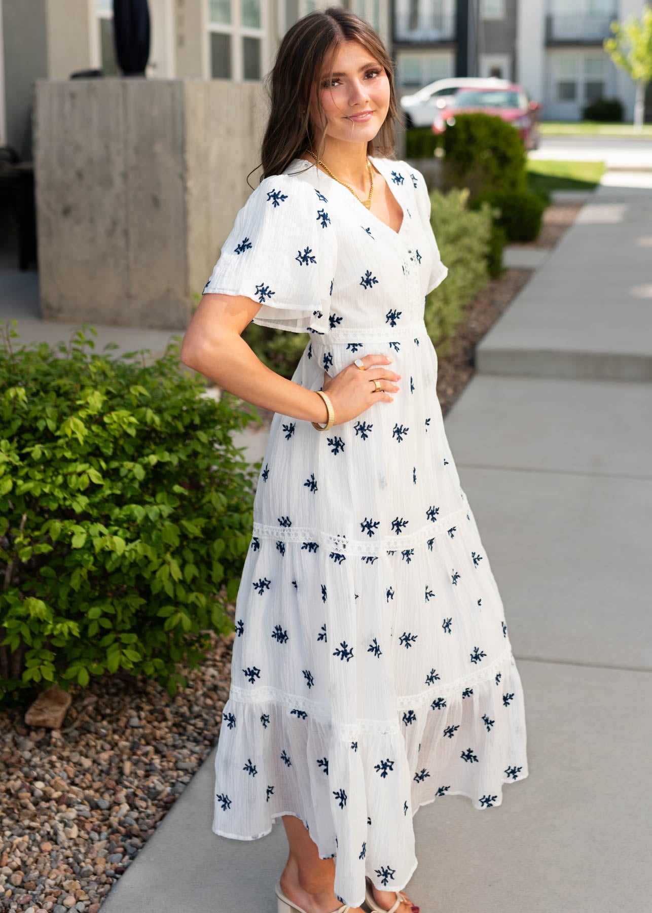 Side view of the white embroiered dress